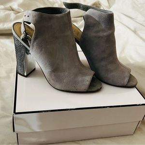 Women’s Guess gray suede, studded heels.